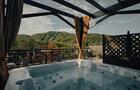 Bains tourbillons vue montagne été © Hôtel Château-Bromont